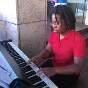 playing on an outdoor piano